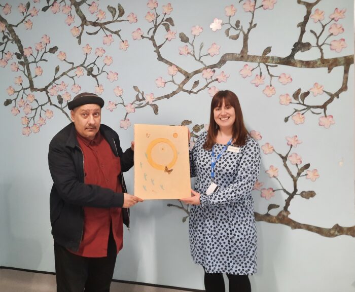 Angelo donates a beautiful painting