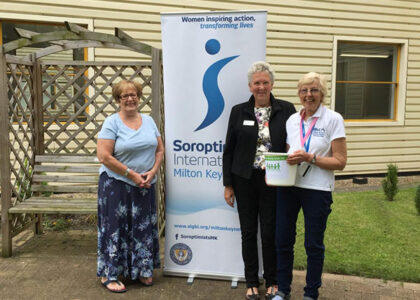 Sue, Vanessa (centre) and Jaff (right, holding the bucket) fundraising for us at the NHS 70th birthday Big Tea