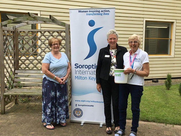 Sue, Vanessa (centre) and Jaff (right, holding the bucket) fundraising for us at the NHS 70th birthday Big Tea