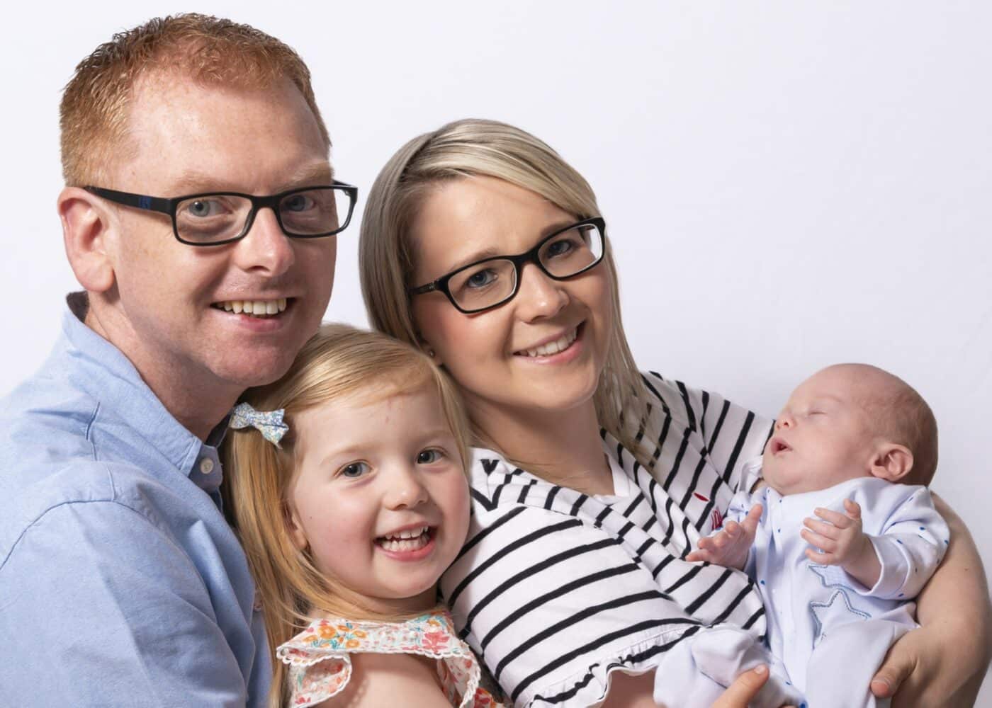 A man, woman, young girl and a baby
